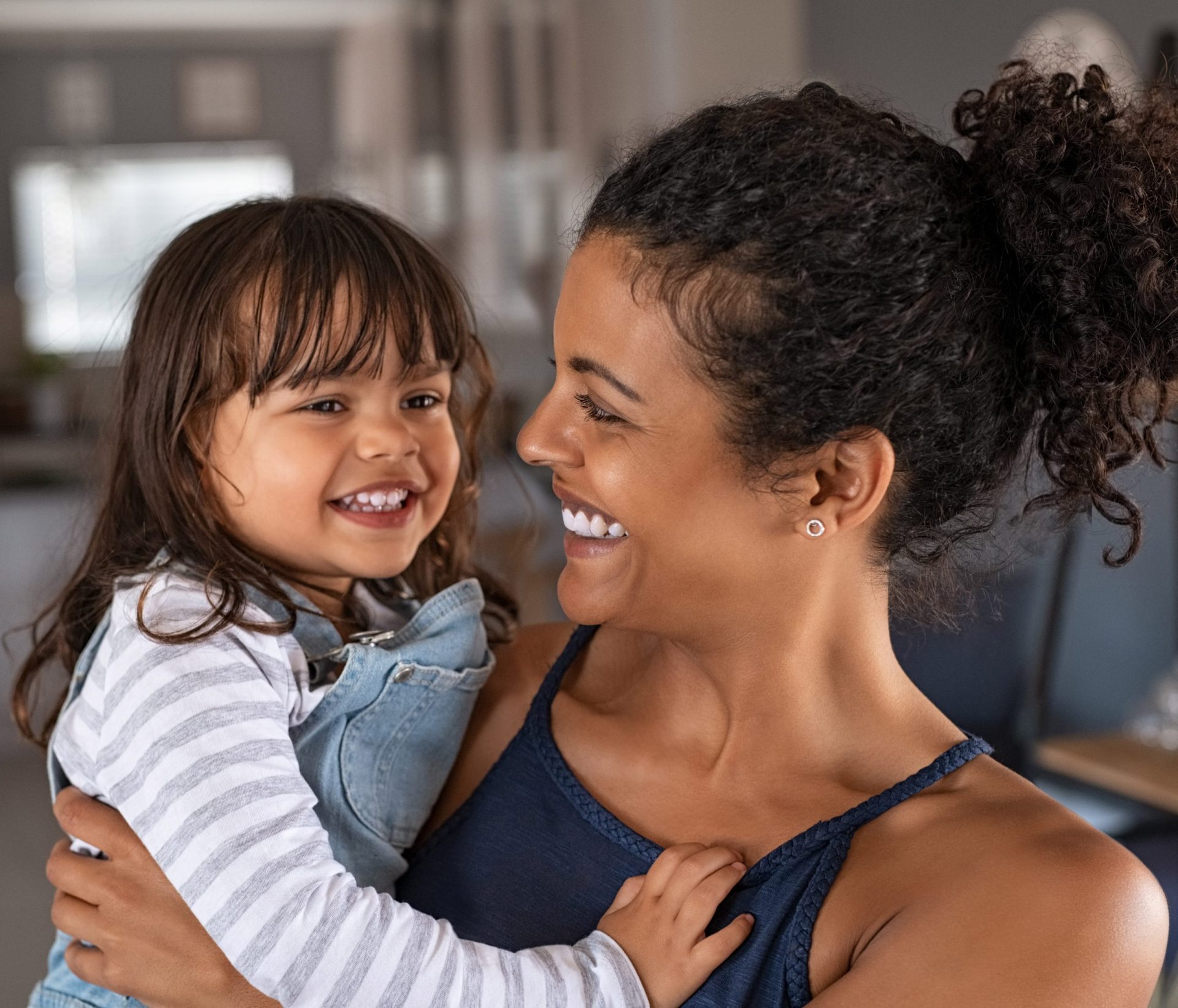 photo of Smiling mother and daughter 